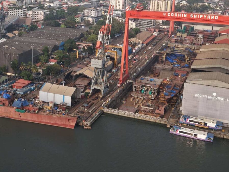 Aerial view of a commercial shipyard undergoing infrastructure upgrades under the Indian shipbuilding scheme.
