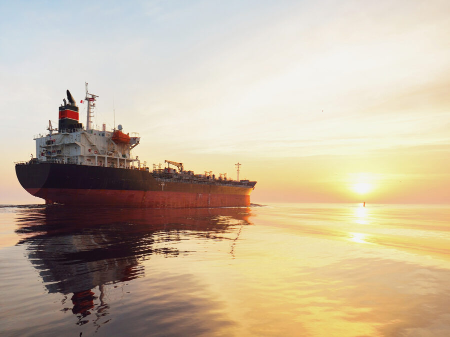 Container ship navigating regional waters where war risk clauses govern chartering decisions.