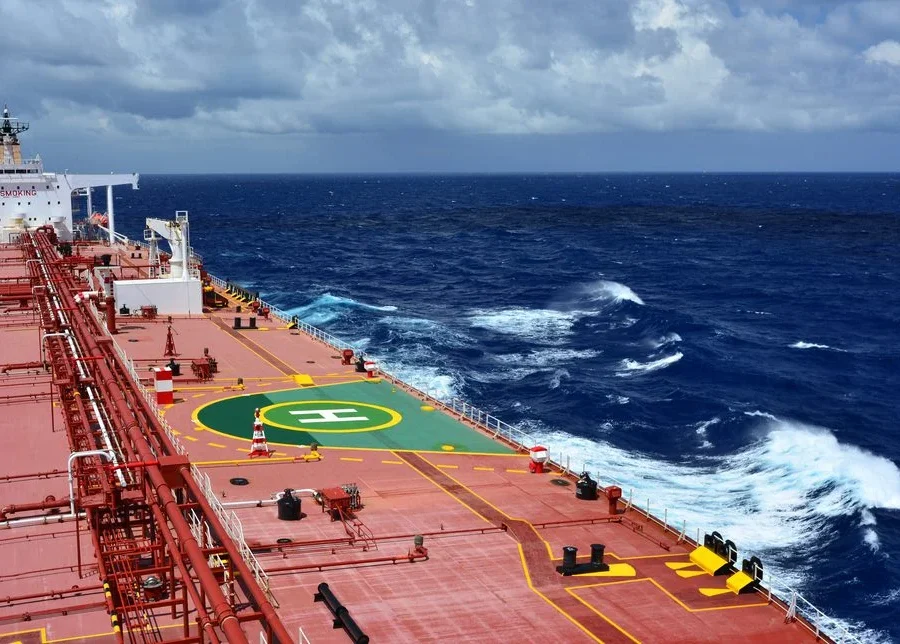 Commercial cargo vessel navigating open ocean to illustrate maritime tonne-mile demand and trade route efficiency.