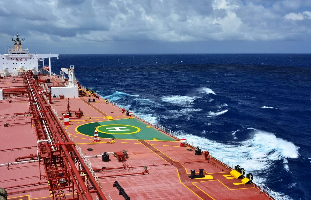 Commercial cargo vessel navigating open ocean to illustrate maritime tonne-mile demand and trade route efficiency.
